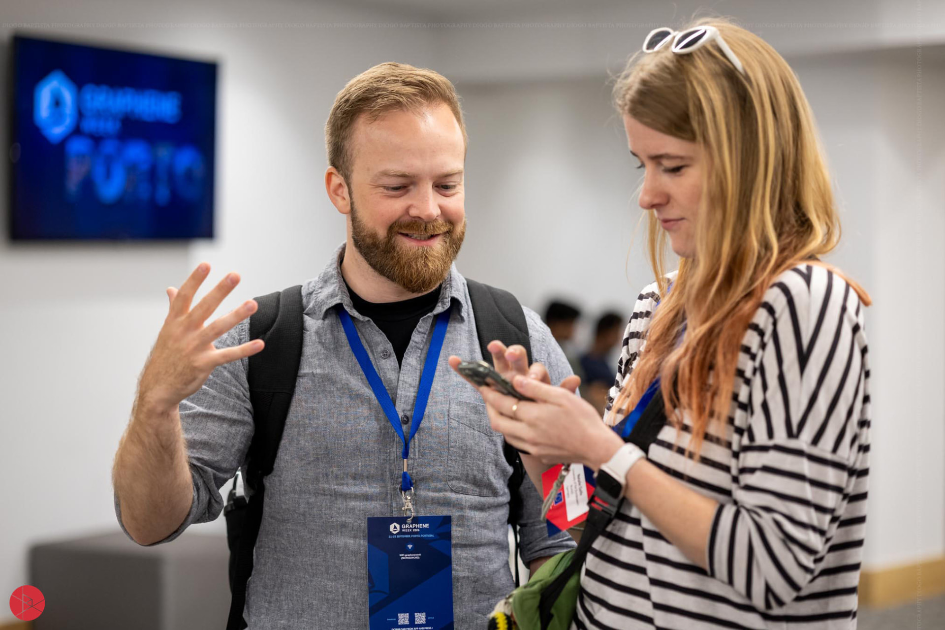 Two conference delegates sharing a conversation