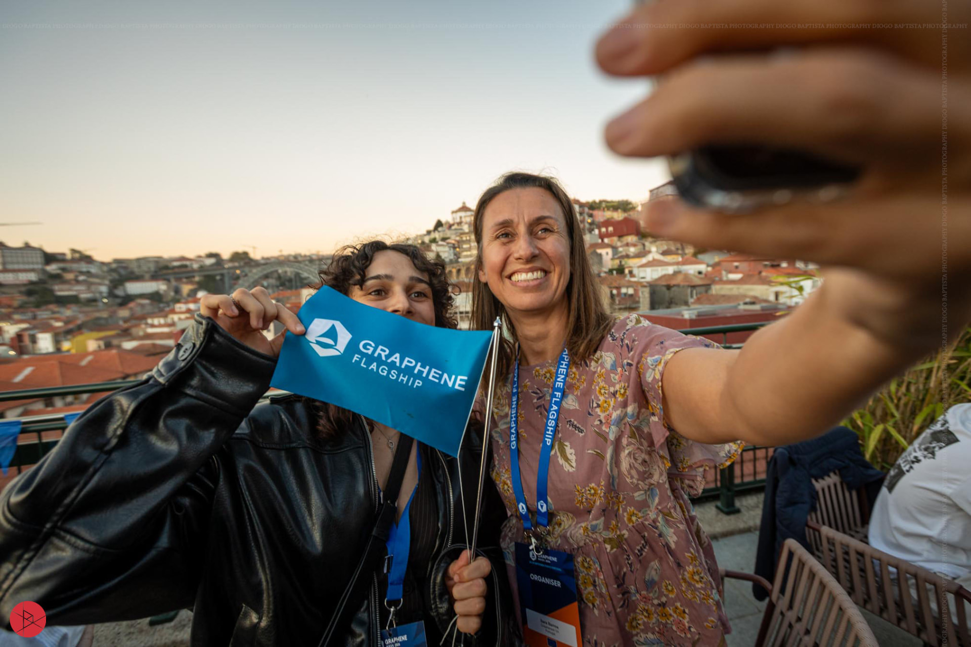 Graphene Flagship attendees celebrating together above the city of Porto